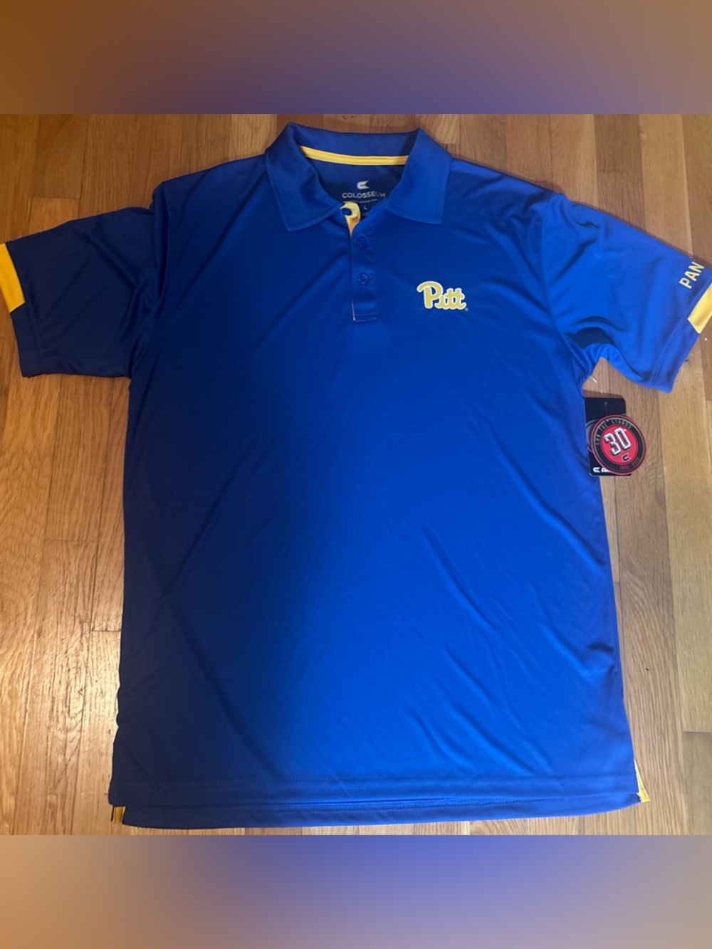 Colosseum Blue and Yellow Pitt Logo Polo